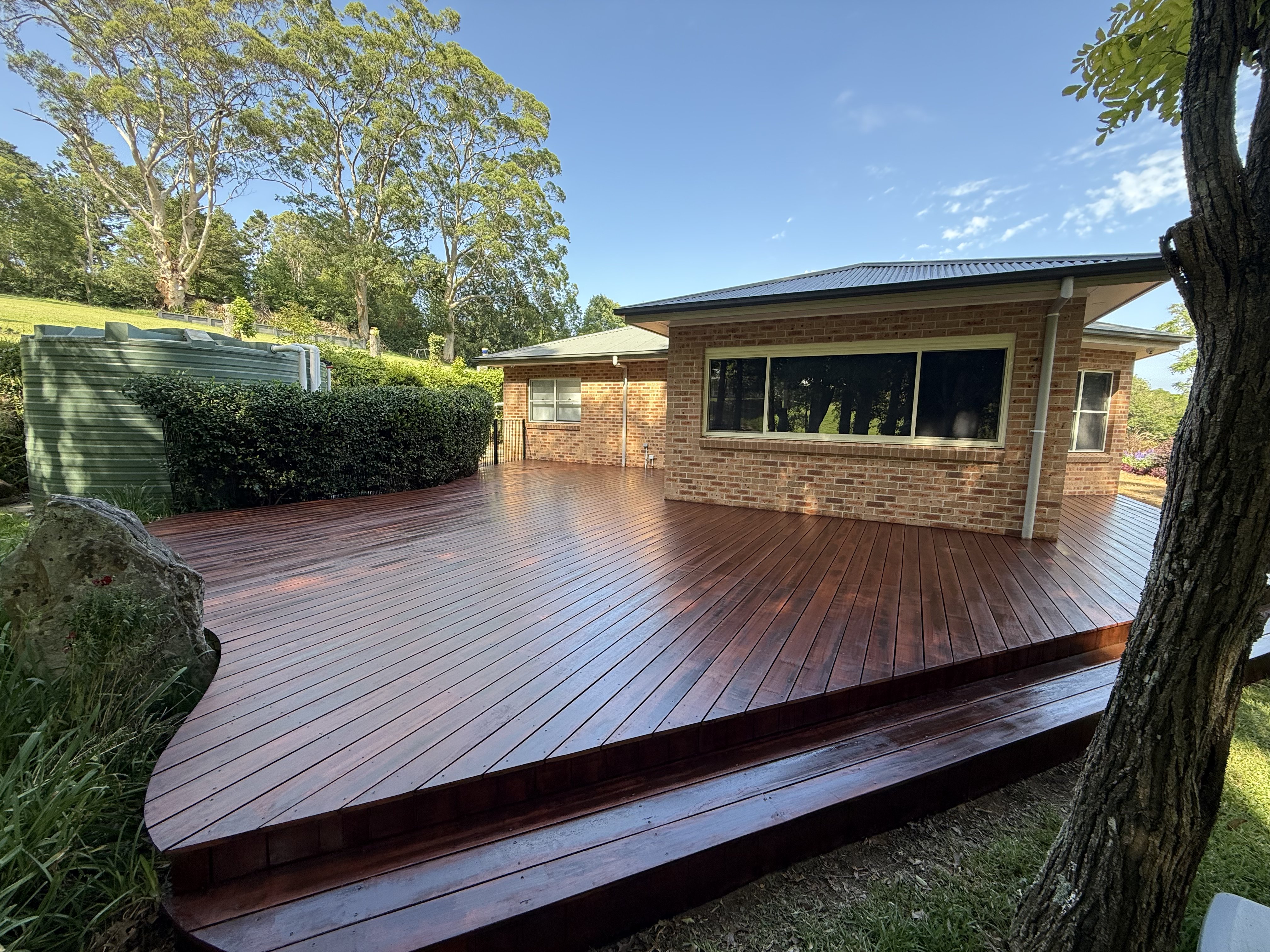 Custom hardwood deck built by Superior Carpentry & Maintenance